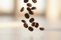 Roasted coffee beans falling in motion Royalty Free Stock Photo