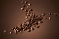 Roasted coffee beans falling on a warm brown background Royalty Free Stock Photo