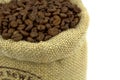 Roasted coffee beans in a flax bag Royalty Free Stock Photo