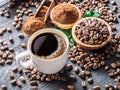 Roasted coffee beans, ground coffee and cup of coffee on wooden Royalty Free Stock Photo