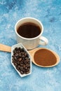 Roasted coffee beans, ground coffee, Cup of coffee, Wooden spoon with roasted coffee Royalty Free Stock Photo