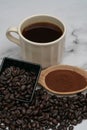 Roasted coffee beans, ground coffee, Cup of coffee, Wooden spoon with roasted coffee Royalty Free Stock Photo