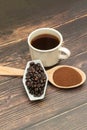 Roasted coffee beans, ground coffee, Cup of coffee, Wooden spoon with roasted coffee Royalty Free Stock Photo