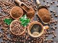 Roasted coffee beans, ground coffee and cup of coffee on wooden Royalty Free Stock Photo