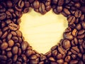 Roasted coffee beans with heart form Royalty Free Stock Photo