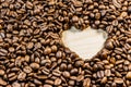 Roasted coffee beans with heart form Royalty Free Stock Photo