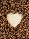 Roasted coffee beans with heart form Royalty Free Stock Photo
