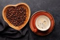 Roasted coffee beans in heart shaped bowl Royalty Free Stock Photo