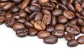 Roasted coffee beans isolated on a white background.