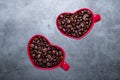 Roasted Coffee Beans and Love Cups Royalty Free Stock Photo