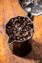 Roasted coffee beans in mocca pot Royalty Free Stock Photo