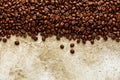 Roasted coffee beans over scratched stone wall texture