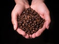 Roasted Coffee Beans overhead view held by woman in cupped hands