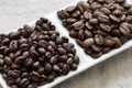 Roasted coffee beans, peaberry and flat bean Royalty Free Stock Photo