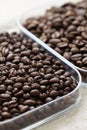 Roasted coffee beans, peaberry and flat bean Royalty Free Stock Photo