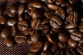 Roasted coffee beans pile on burlap Royalty Free Stock Photo