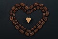 Roasted coffee beans placed in a shape of heart Royalty Free Stock Photo