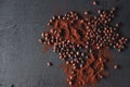 Roasted coffee beans and coffee powder on a black background Royalty Free Stock Photo