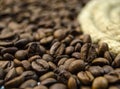 Roasted coffee beans beside the rope Royalty Free Stock Photo