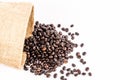 Roasted coffee beans from sack bag Royalty Free Stock Photo