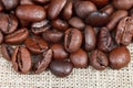 Roasted coffee beans on sackcloth Royalty Free Stock Photo