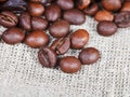 Roasted coffee beans on sackcloth Royalty Free Stock Photo