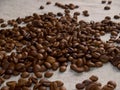 Roasted coffee beans scattered on a burlap napkin Royalty Free Stock Photo