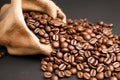 Roasted coffee beans scattered out of a bag