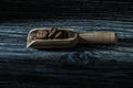 Roasted coffee beans in scoop on wooden board Royalty Free Stock Photo