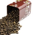 Roasted coffee beans spilling out of a metal box Royalty Free Stock Photo