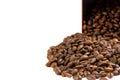 Roasted coffee beans spilling out of a metal box Royalty Free Stock Photo