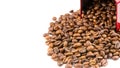 Roasted coffee beans spilling out of a metal box Royalty Free Stock Photo