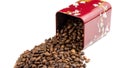 Roasted coffee beans spilling out of a metal box Royalty Free Stock Photo