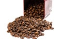 Roasted coffee beans spilling out of a metal box Royalty Free Stock Photo