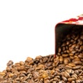 Roasted coffee beans spilling out of a metal box Royalty Free Stock Photo