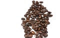 Roasted coffee beans splatter isolated on a white background