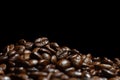 Roasted Coffee Beans texture on dark background, macro Royalty Free Stock Photo