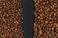 Roasted coffee beans. Two sorts of arabica on black background Royalty Free Stock Photo