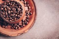 Close-up roasted coffee beans in a vintage ceramic brown cup. Symbolic image. Top view, selective focus,copy space Royalty Free Stock Photo