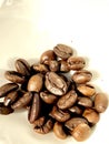 Roasted coffee beans. On a white ceramic plate Royalty Free Stock Photo