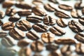 Roasted coffee beans on white milk background. Coffee beans in milk. Top view macro shot of arabica, robusta and iberica coffee se