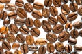 Roasted coffee beans on white milk background. Coffee beans in milk. Top view macro shot of arabica, robusta and iberica coffee se