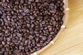 Roasted coffee beans on wooden background from top view Royalty Free Stock Photo