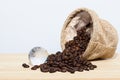 Roasted coffee beans and world glass balls Royalty Free Stock Photo