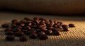 Roasted coffee beans on woven mat, warm light, inviting aroma, close-up Royalty Free Stock Photo