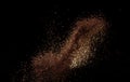 Roasted Coffee powder ground dust splash explosion in mid Air. Ground Coffee roasted powder dust fly explosion, Coffee crushed Royalty Free Stock Photo