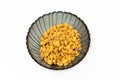 Roasted corn nuts in plate on white background Royalty Free Stock Photo