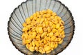 Roasted corn nuts in plate on white background Royalty Free Stock Photo