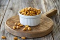 Roasted corn snack. Corn nuts with sauce on wood background Royalty Free Stock Photo