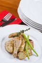 Roasted Cornish Game Hen Served and Potatoes Royalty Free Stock Photo